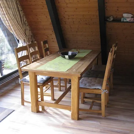 Wooden Bungalow With A Terrace In A Wooded Area
