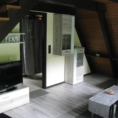 Wooden Bungalow With A Terrace In A Wooded Area